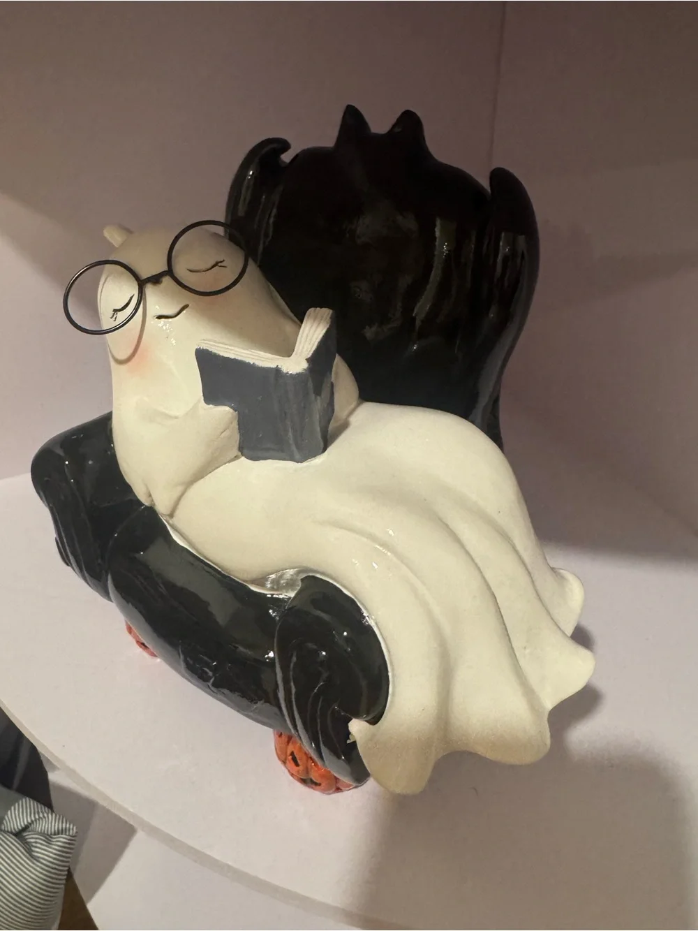 White Ghost Figurine on Black Chair Halloween Décor